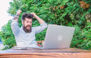 The more bet is the more winning will be. Happy hipster celebrating winning bet. Gamer making his bet in online casino with laptop computer. Bearded man placing bet in casino game.