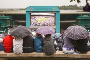 LONDON, UK - June 24, 2011. Wimbledon tennis match. Crowd watching tournament at the stadium on a big screen from Murray Mount or Henman Hill, London,